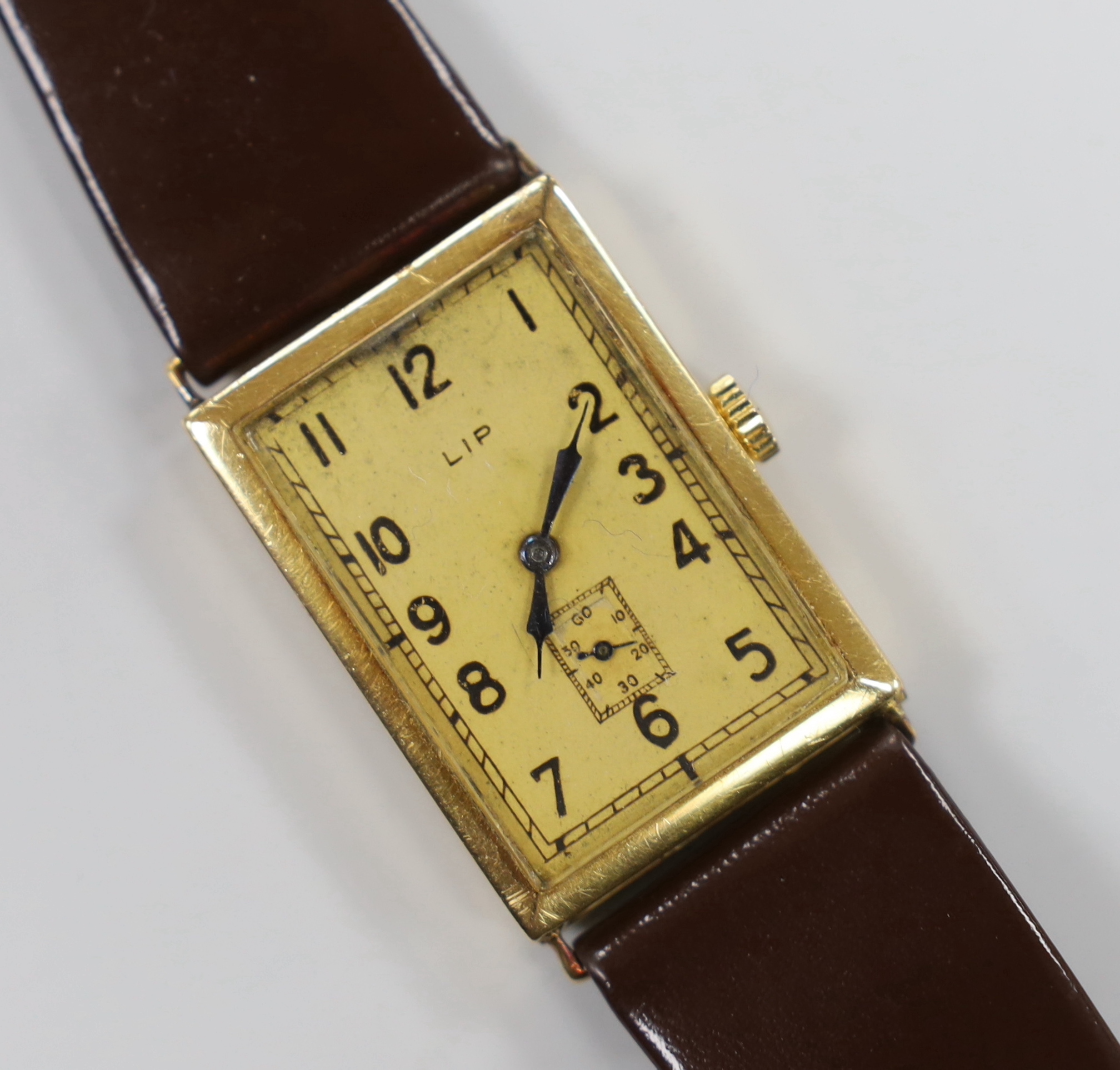 A French yellow metal (18ct poincon mark) LIP T18 'Churchill' manual wind rectangular Arabic dial wrist watch, with subsidiary seconds, on a later strap.